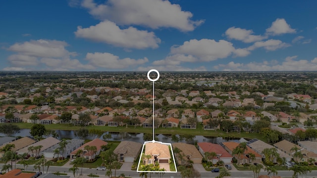 bird's eye view featuring a residential view and a water view