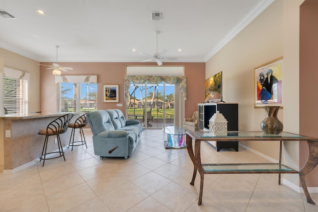 living area featuring ornamental molding, visible vents, and light tile patterned floors