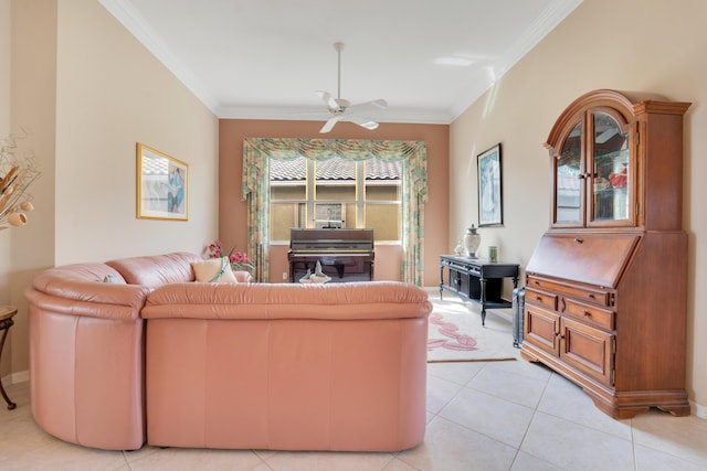 living area with light tile patterned floors, ceiling fan, and ornamental molding