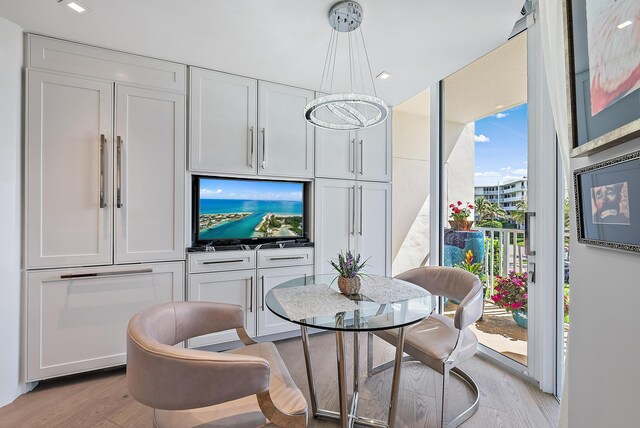 living room with ornamental molding and floor to ceiling windows