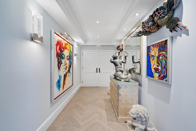 corridor featuring a tray ceiling, recessed lighting, and baseboards