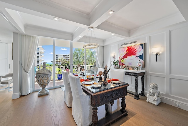 dining area featuring light wood-style floors, coffered ceiling, a decorative wall, and beamed ceiling