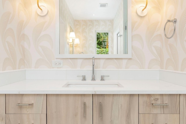 205 Greymon Dr, West Palm Beach, FL 33405 - bathroom featuring wallpapered walls and vanity