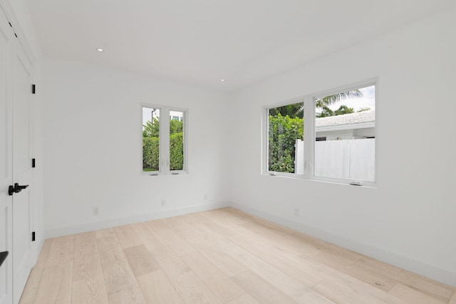 205 Greymon Dr, West Palm Beach, FL 33405 - spare room featuring wood finished floors, baseboards, and recessed lighting