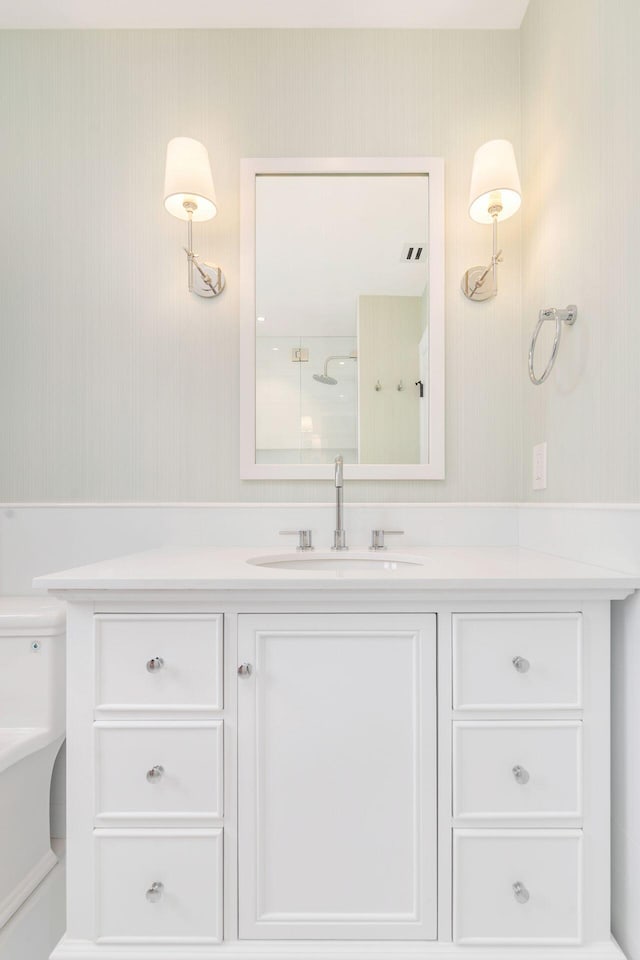 205 Greymon Dr, West Palm Beach, FL 33405 - bathroom with vanity, wallpapered walls, toilet, and a shower