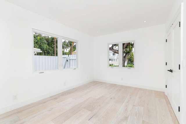 205 Greymon Dr, West Palm Beach, FL 33405 - spare room featuring light wood-style floors and baseboards