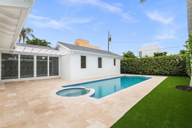 205 Greymon Dr, West Palm Beach, FL 33405 - view of pool featuring a pergola, a patio area, a pool with connected hot tub, and a lawn