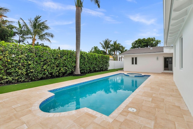 205 Greymon Dr, West Palm Beach, FL 33405 - view of swimming pool featuring a patio, a fenced backyard, and a pool with connected hot tub