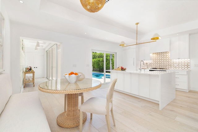 205 Greymon Dr, West Palm Beach, FL 33405 - dining space with light wood-style floors, recessed lighting, and a raised ceiling
