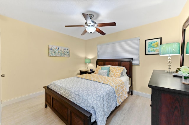 bedroom featuring baseboards and a ceiling fan