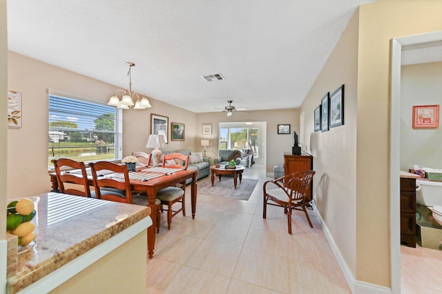 dining area featuring plenty of natural light, visible vents, baseboards, and light tile patterned flooring