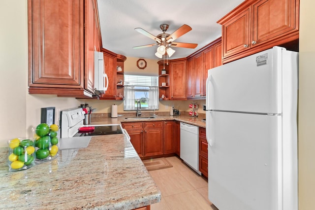 kitchen with white appliances, a sink, a ceiling fan, open shelves, and brown cabinetry