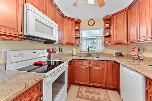 kitchen with brown cabinetry, white appliances, open shelves, and a sink