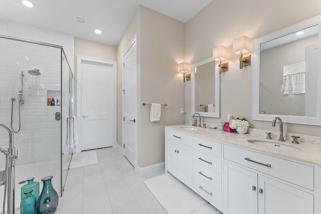 full bathroom featuring a stall shower, visible vents, a sink, and double vanity