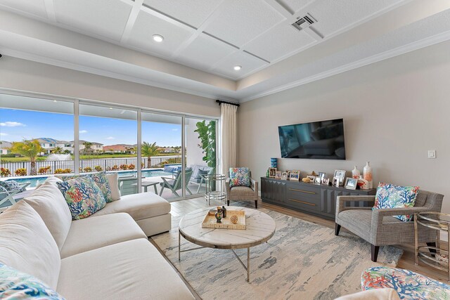 living area featuring recessed lighting, coffered ceiling, wood finished floors, visible vents, and crown molding