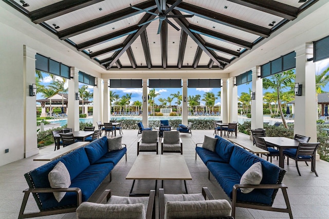 sunroom with vaulted ceiling with beams