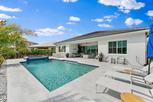 back of house with a pool with connected hot tub, an outdoor living space, a ceiling fan, stucco siding, and a patio area