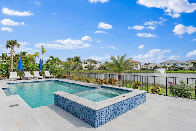 view of pool featuring a fenced backyard, an in ground hot tub, a water view, a residential view, and a patio area