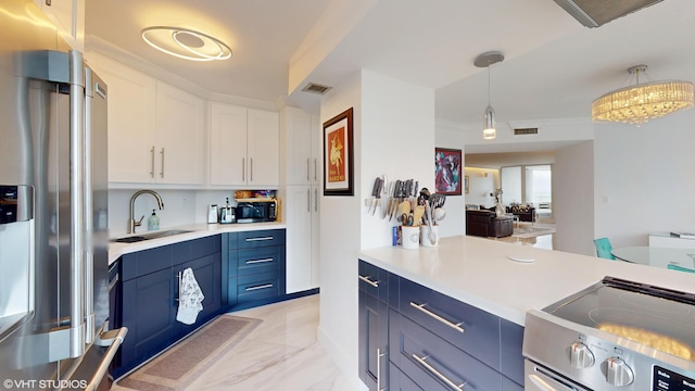 kitchen featuring range with electric stovetop, stainless steel refrigerator with ice dispenser, a sink, and blue cabinets