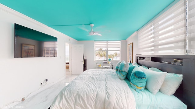 bedroom featuring crown molding and ceiling fan