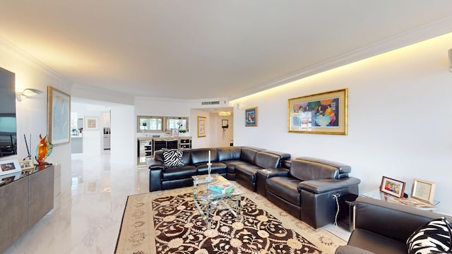 living area with ornamental molding, marble finish floor, visible vents, and beverage cooler