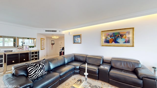 living area featuring ornamental molding and visible vents