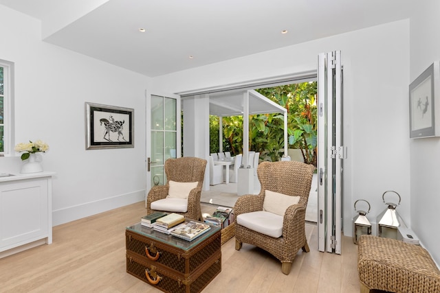 sitting room featuring light wood-style floors and baseboards