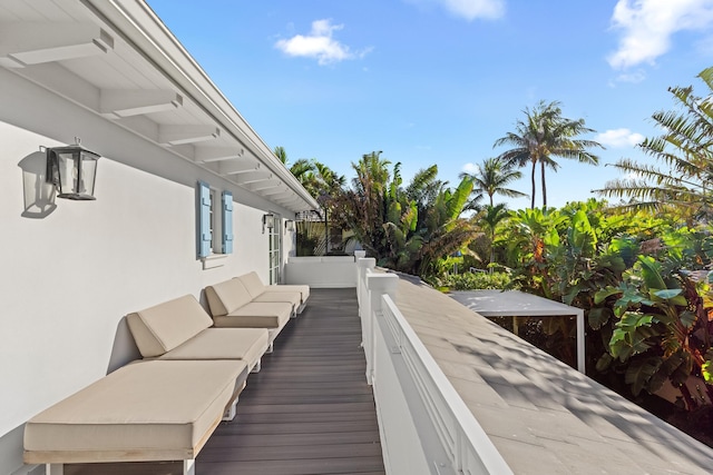 wooden deck featuring an outdoor hangout area