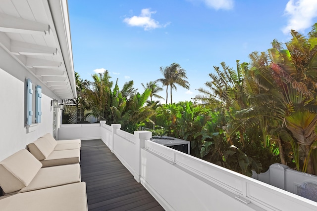 wooden deck featuring an outdoor living space