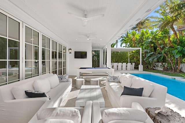 exterior space featuring a ceiling fan, a fenced in pool, a patio, fence, and an outdoor living space