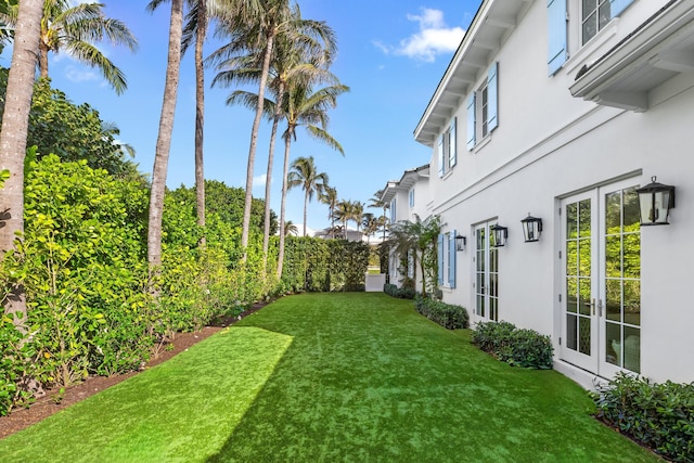 view of yard featuring french doors