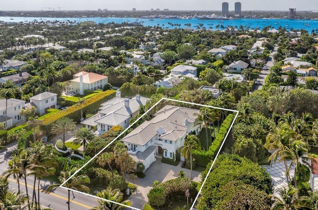 bird's eye view with a water view and a residential view