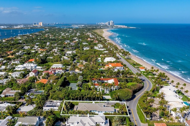 bird's eye view with a water view and a view of the beach