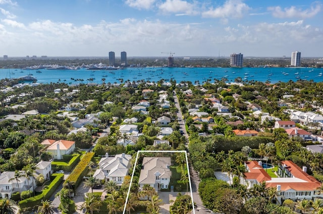 drone / aerial view with a water view and a residential view