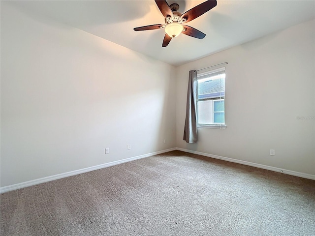 empty room featuring ceiling fan, baseboards, and carpet flooring