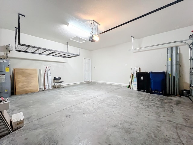 garage featuring a garage door opener and electric water heater