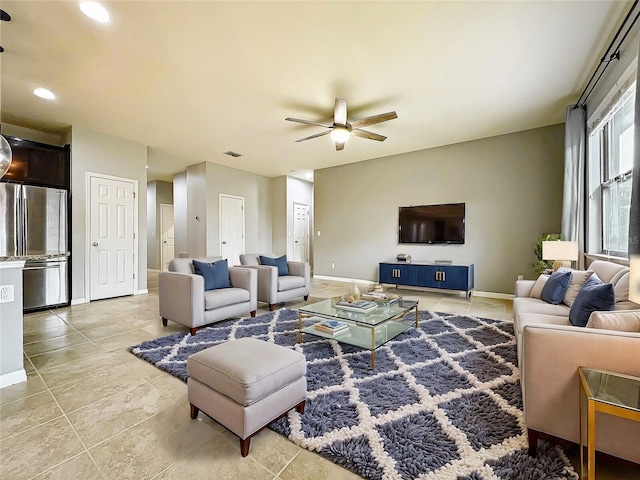 living room with ceiling fan, recessed lighting, visible vents, and baseboards