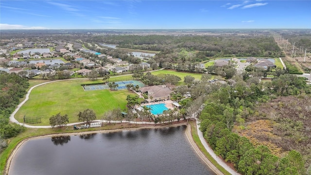 drone / aerial view with a water view and a residential view