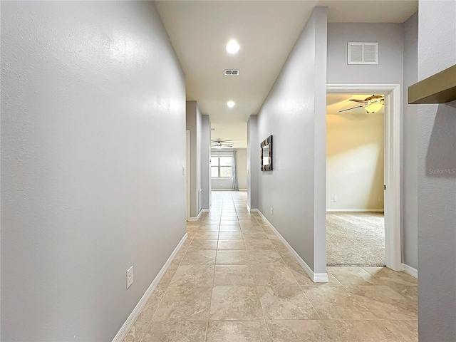 hall featuring recessed lighting, visible vents, and baseboards