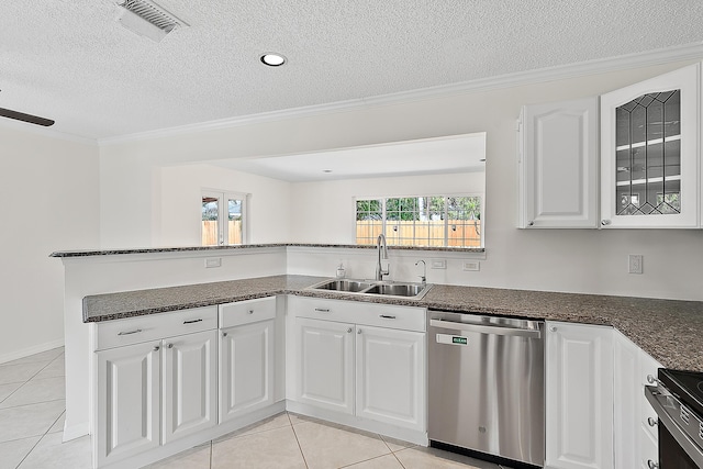 kitchen with ornamental molding, appliances with stainless steel finishes, a sink, and white cabinets