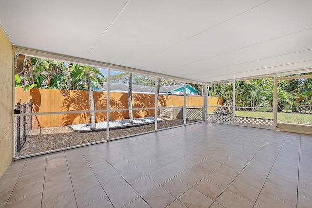 unfurnished sunroom featuring a wealth of natural light