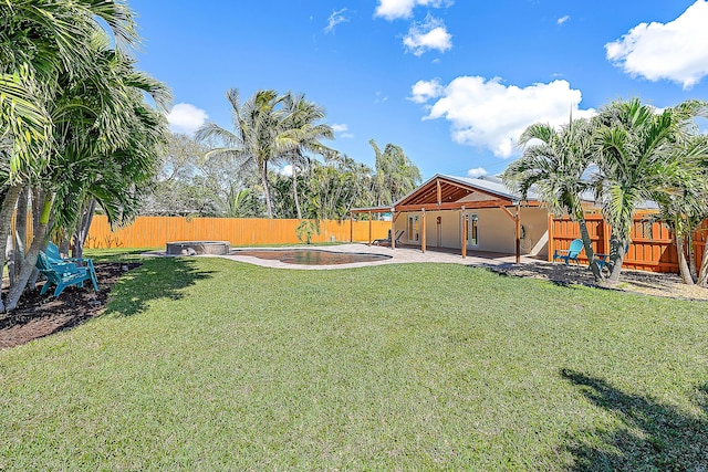 view of yard featuring a patio area and a fenced backyard