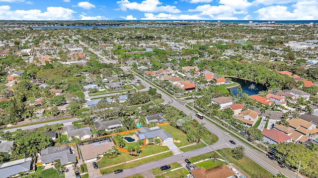 bird's eye view featuring a water view and a residential view