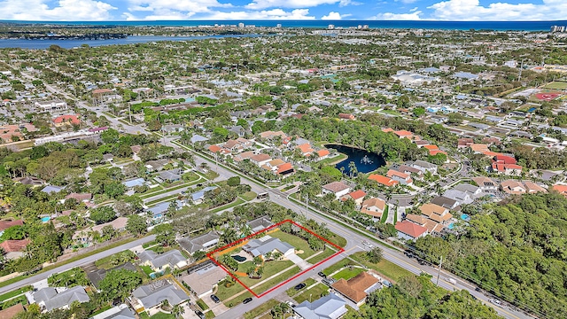 bird's eye view featuring a water view and a residential view