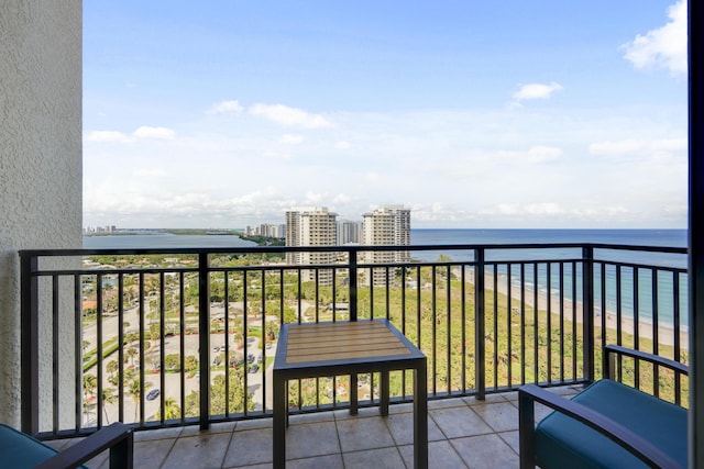 balcony featuring a water view and a view of city