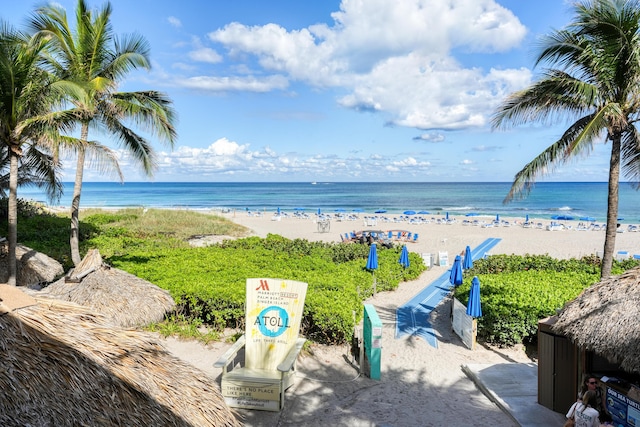 property view of water featuring a beach view