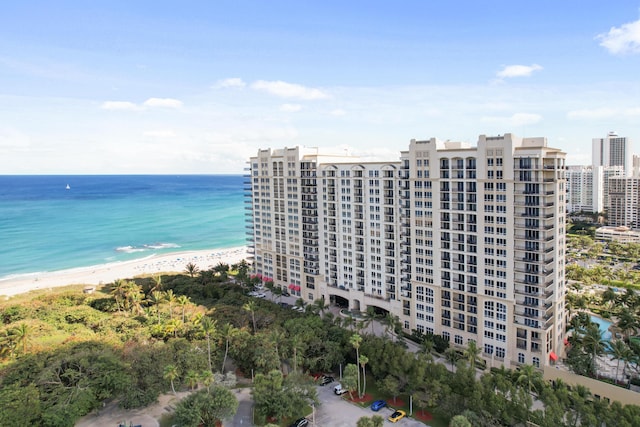 aerial view featuring a water view and a beach view