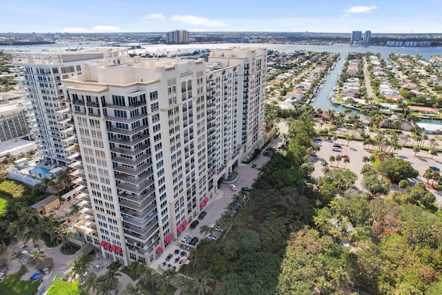 birds eye view of property featuring a view of city and a water view