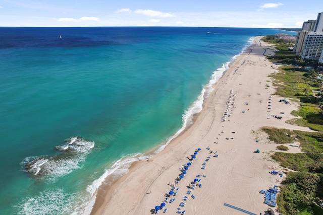 birds eye view of property featuring a water view and a view of the beach