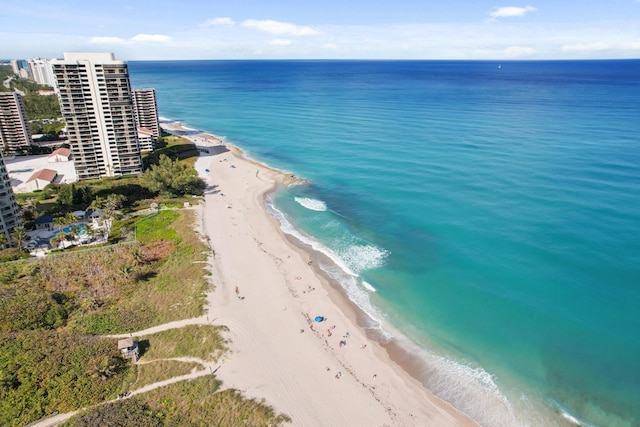 aerial view with a water view and a beach view